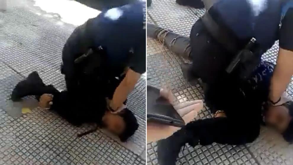 Spanish police video kneels on the neck of teenager