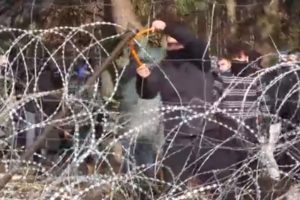 Poland accused Belarus of attempting to incite a major confrontation after video footage showed hundreds of migrants walking towards border