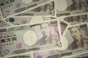 Yen jumps more than 1% against dollar on policy talk