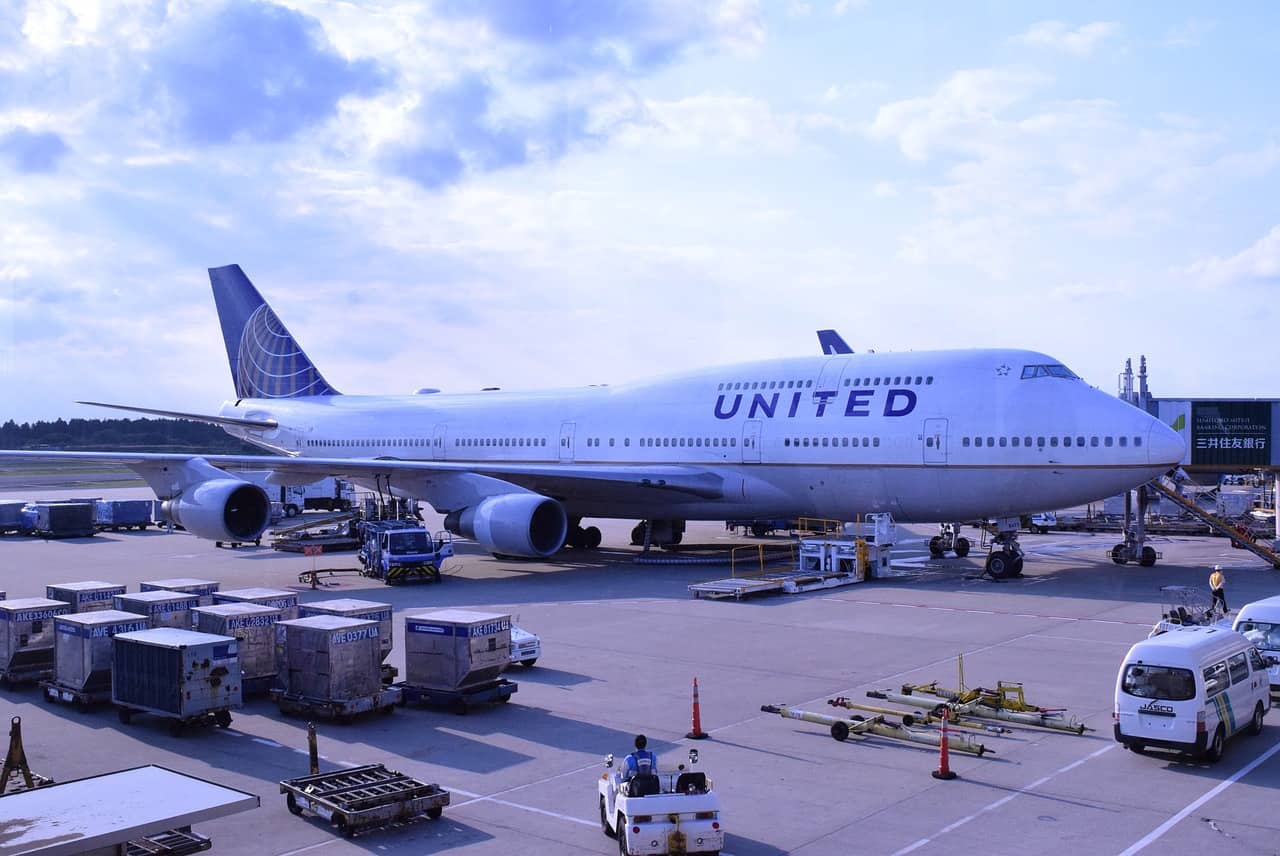 Man open emergency exit door flight Boston