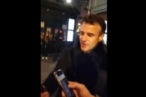 Macron seen singing in the streets after pensions address