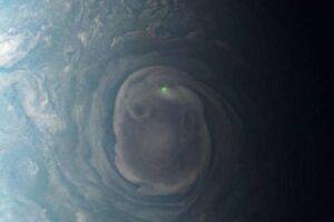 NASA spacecraft captures glowing green dot on Jupiter