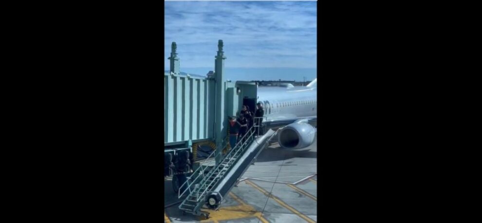 US flight diverted after man tries to open emergency exit