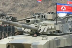 N. Korean leader unveils and 'drives' new battle tank