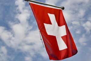 Swiss central bank cuts rate in first among developed economies