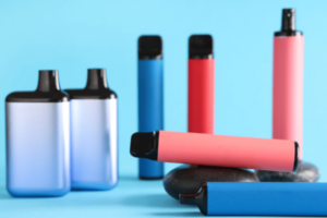 Different Electronic Vapes on Blue Background