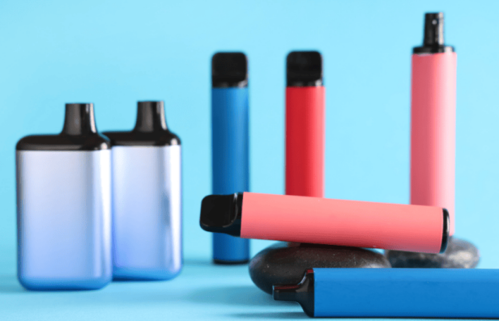 Different Electronic Vapes on Blue Background