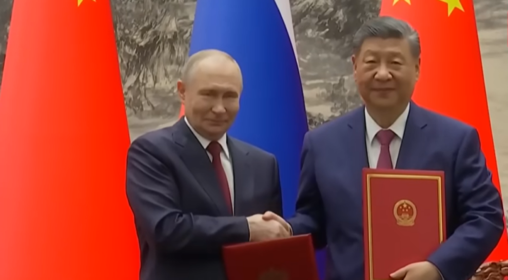 How did Putin and Trump's visits to China compare?