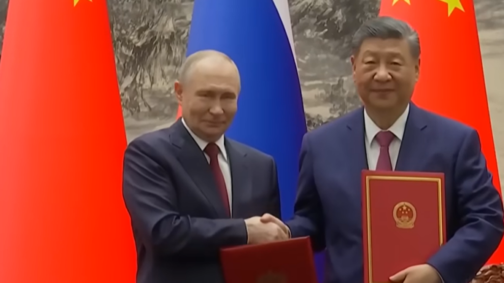 How did Putin and Trump's visits to China compare?