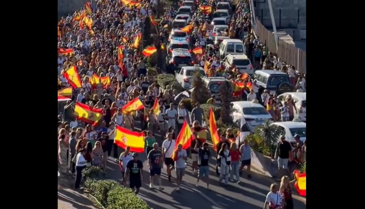 Spanish government urges calm after anti-migrant protesters clash with police